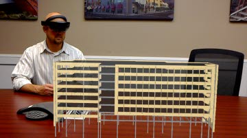 Rob Heagy, director of drafting services at High Concrete Group LLC, looks at an augmented reality model through a Microsoft HoloLens.